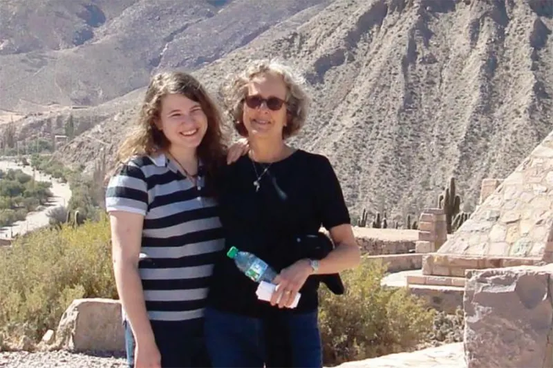 two women standing by mountain