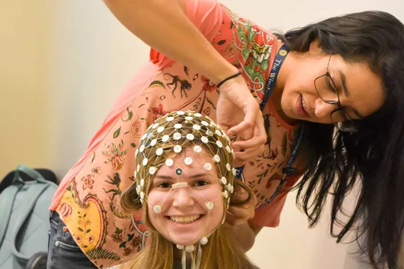 girl doing someone's hair