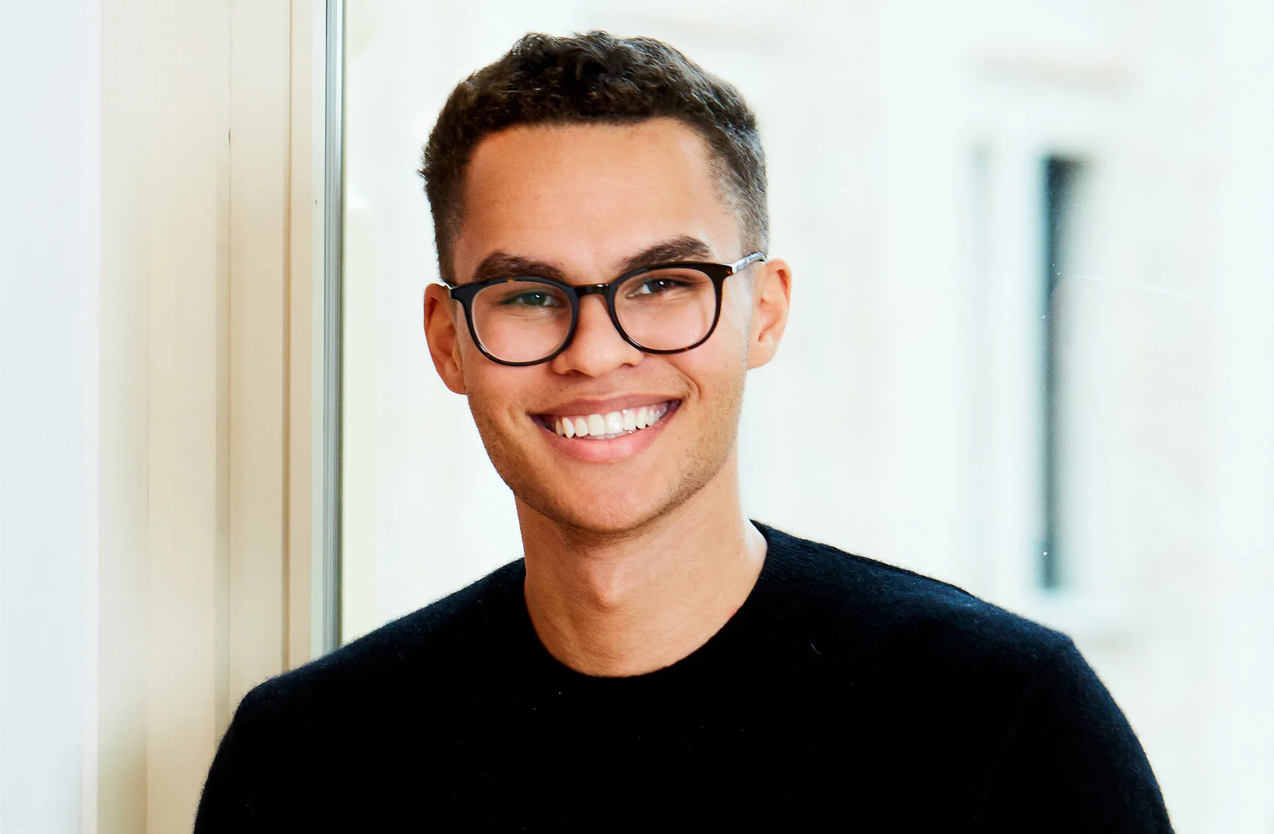 headshot of man with glasses